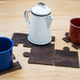 Illustration for article titled Spruce Up Your Coffee Table With These Handmade Puzzle Coasters ($12)